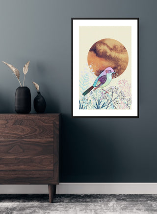 Sunrise bird and flowers poster featuring a colorful bird on branches with a warm sunrise background, framed on a wall.