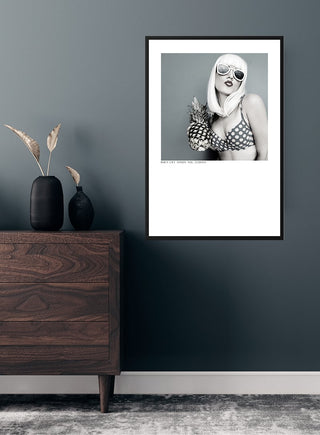 Framed "When life hands you lemons" poster featuring a stylish woman in sunglasses, displayed on a grey wall.