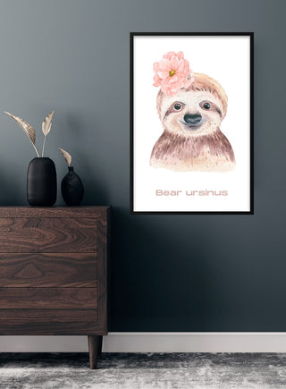 Children’s poster featuring a cute bear with a pink flower, hanging on a wall above a dresser.