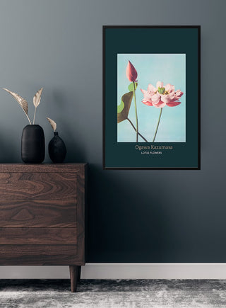 Framed Lotus Flowers by Ogawa Kazumasa Japanese art poster hanging on a dark teal wall above a wooden dresser.