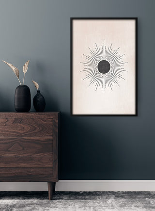 Black Sun Plakat wall art featuring a minimalist black sunburst design, displayed in a modern room setting.