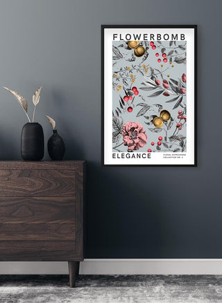 Framed Flowerbomb - Elegance Plakat with floral design hangs on a dark wall above a wooden dresser.