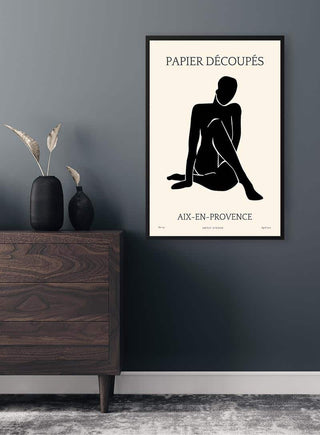Minimalist Papier Decoupe No. 03 art print featuring a black silhouette, displayed in a modern living room setting.