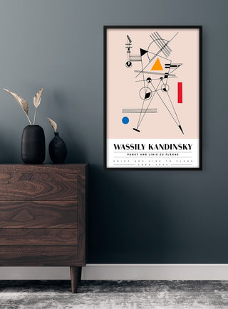 Framed Kandinsky "Punkt und Linie" poster with abstract geometric shapes, displayed above a dark wood dresser.