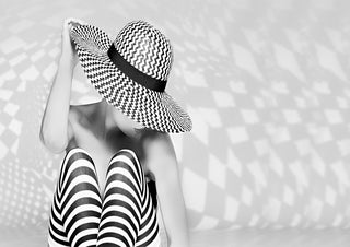 Black and white Zig the Zag poster showing a person in striped leggings and a large zigzag-patterned hat.