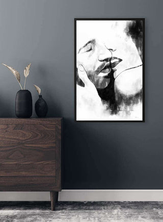 Black and white Kiss Close Plakat poster framed on a gray wall above a wooden dresser in a modern room.