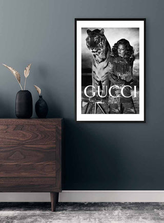 Framed Gucci Tiger Fashion Plakat on a dark wall, featuring model with tiger in monochrome style.