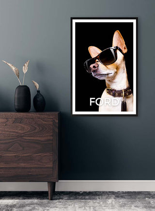 Framed "Cool as Ford Black" poster featuring a dog wearing sunglasses, displayed above a dark wooden dresser.