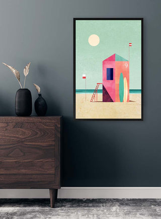 Framed Surf Hut - Henry Rivers art print on wall above a wooden dresser in a modern room.