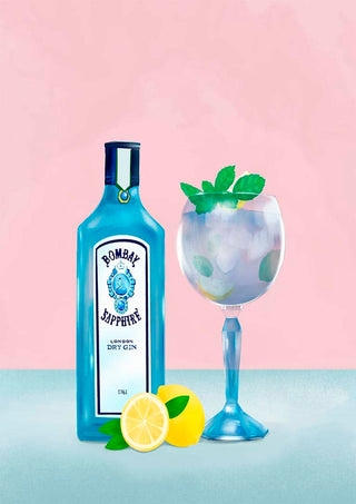 A bottle of Bombay Sapphire gin beside a gin cocktail garnished with mint and lemon on a pastel background.