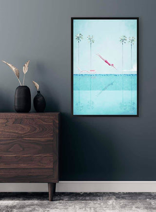 Framed "Swimming Pool II" by Henry Rivers hanging on a gray wall above a wooden dresser in a modern room.