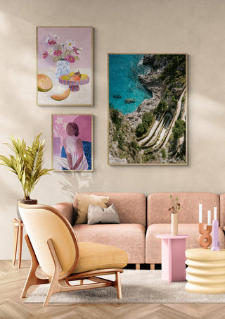 Framed photo of Gardens of Augustus hanging on a beige wall above a pink sofa in a modern living room.