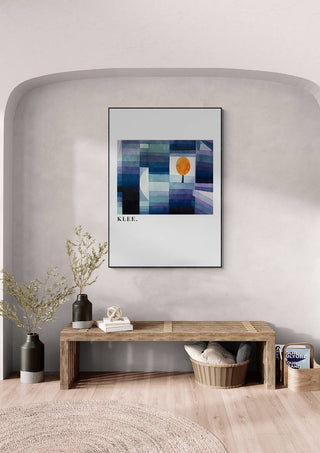 Framed print of Paul Klee's "The Harbinger of Autumn" displayed above a wooden bench in a modern interior.