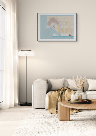 Framed Christine Buchholtz "Copenhagen" artwork displayed above a modern sofa in a bright living room.