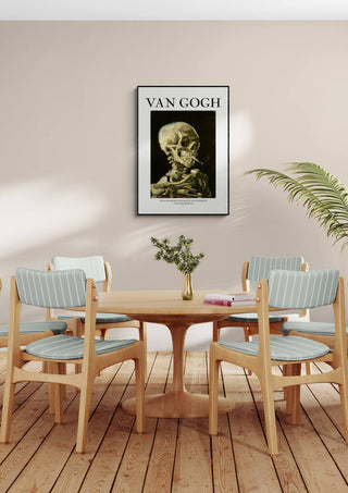 Framed "Crane De Squelette - Van Gogh" artwork hanging above a dining table with four chairs.