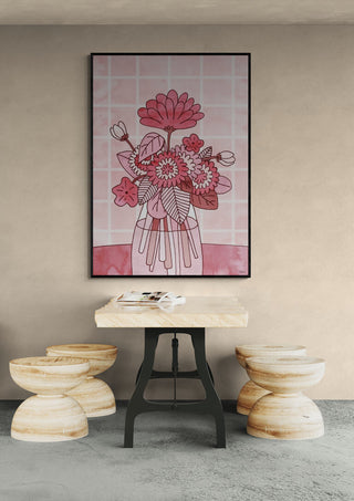 Framed Rose Flowers - Hedwig Wallin artwork above a table with three round stools in a modern room.