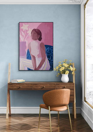 Daydreaming - Goed Blauw artwork on a blue wall above a wooden desk with flowers and a brown chair in a modern room.