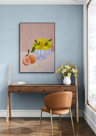 Bittersweet - Goed Blauw artwork hanging above a wooden desk with flowers, chair, and blue wall backdrop.