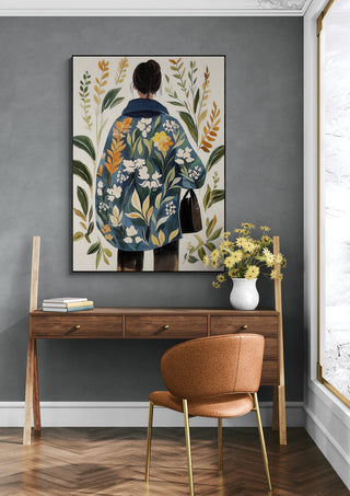 Framed "Look Inside My Soul" artwork by Elara Monet above a modern wooden desk with flowers and chair.