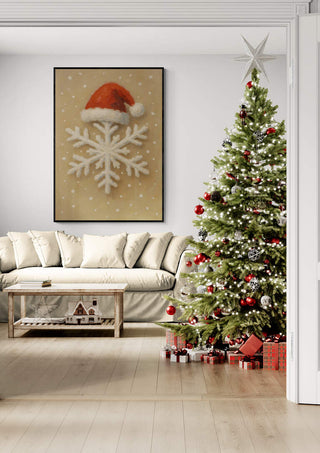 Framed snowflake art with Santa hat above a sofa, next to a decorated Christmas tree and wrapped gifts.