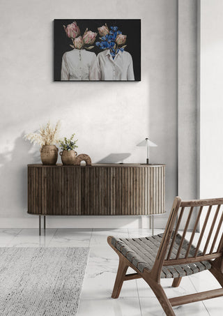 Unknown Longing No.III by Gabriella Roberg artwork above a wooden sideboard in a modern living room setting.