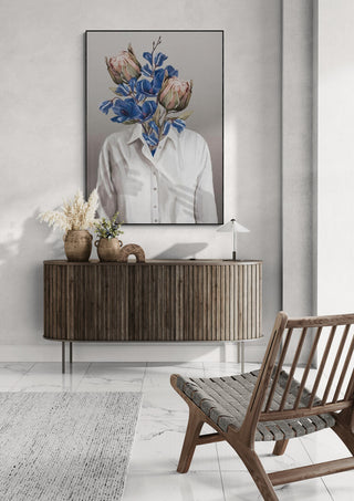 Framed "Unknown Longing No.II" by Gabriella Roberg displayed above a modern wooden console in a stylish room.