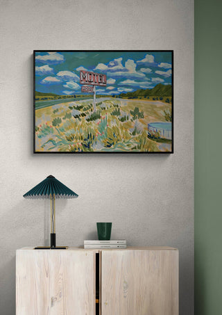 Framed "Meet Me At The Motel" by Eleanor Baker displayed above a cabinet in a modern room.