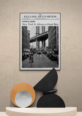 Framed "New York Always Artsy Edition" print featuring a black-and-white city scene above modern decor.
