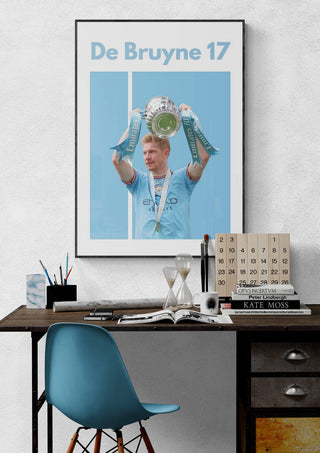 De Bruyne Man City Football Poster featuring De Bruyne lifting a trophy in light blue colors.