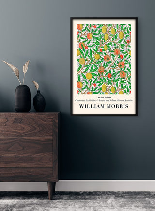 William Morris Lemons Plakat poster with colorful fruit and leaf patterns, framed and hung on a dark wall.