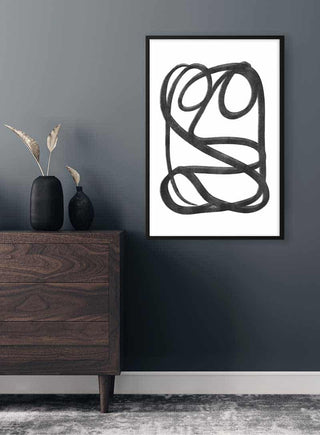 Framed Mysterious Sketch Plakat with black abstract lines, displayed above a dark wooden dresser in a modern room.