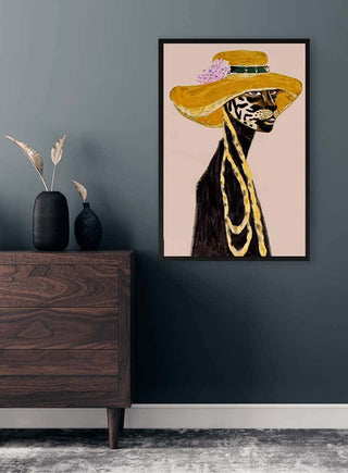 Framed "I'm Makin' Money" by David Wolf displayed above a dark wood dresser in a modern room.