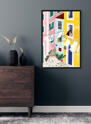 Colorful painting "Chillin" by Maja Tomljanovic on a dark wall above a wooden dresser with vases.