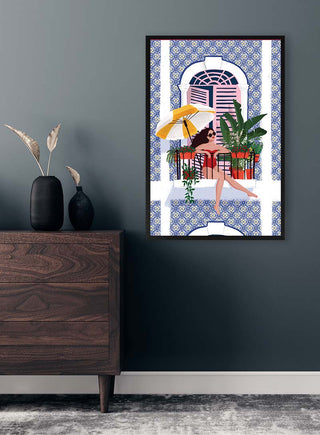 Framed print of "Catching the Sun" by Maja Tomljanovic hanging on a wall above a wooden dresser.