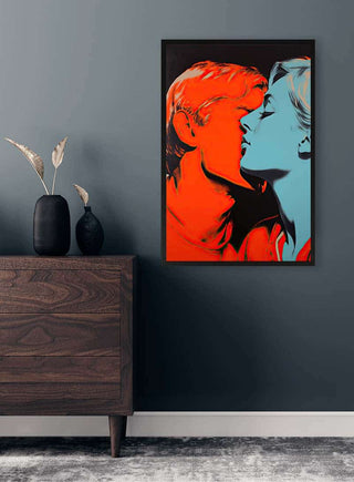 Framed "Kiss Me Andy Warhol - David Wolf" artwork on a gray wall above a wooden dresser with decor.