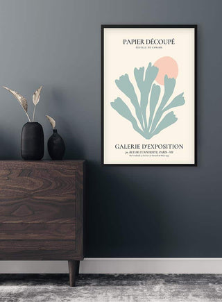 Framed Pastel Blue Coral Decoupe Plakat hanging on a gray wall above a wooden dresser with vases.