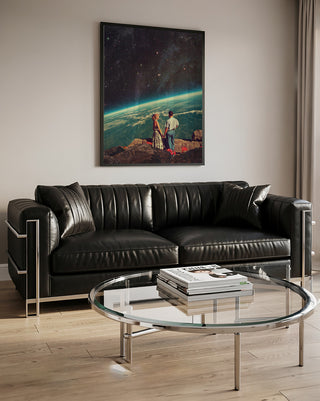 Love - Frank Moth art print hanging above a modern black leather sofa and glass coffee table in a living room.