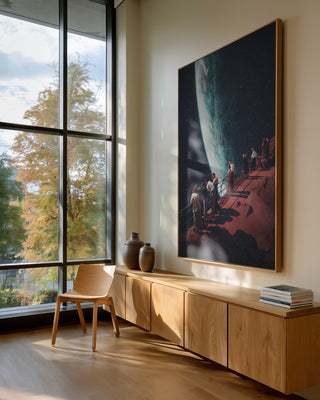 Framed "Missing the Ones We Left Behind" by Frank Moth displayed in a modern, sunlit living room.