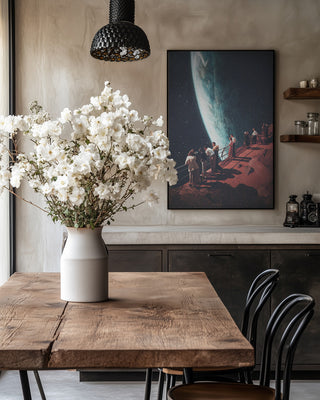 Framed "Missing the Ones We Left Behind" by Frank Moth displayed on a wall in a cozy dining room.