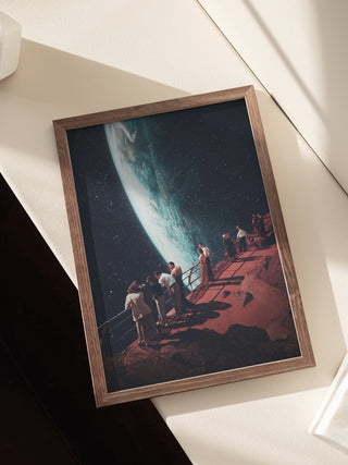 Framed print of Frank Moth’s "Missing the Ones We Left Behind" with people gazing at Earth from another planet.
