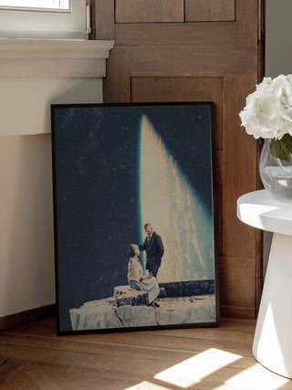 Framed This Love by Frank Moth art print leaning against a wall, showing a couple under a beam of light.