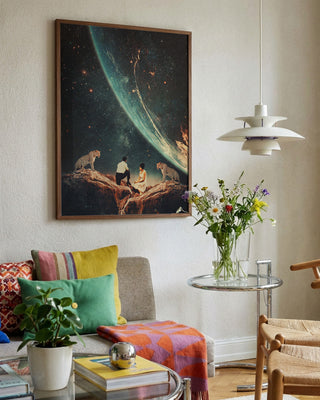 A framed "Guardians of Our Future" artwork by Frank Moth displayed in a cozy, modern living room.