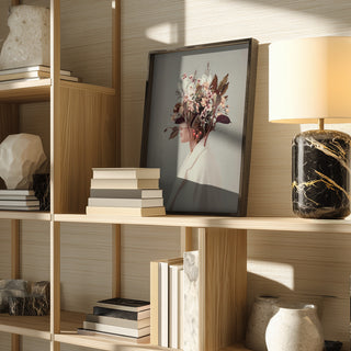 Framed "I Fell In Love With Fall Because of You" by Frank Moth displayed on a wooden shelf with books and decor.