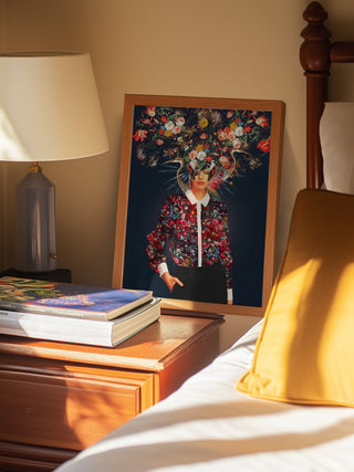 Framed Bright Bloom - Frank Moth artwork resting on a bedside table, featuring floral elements.
