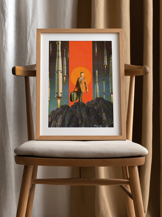 Framed print of "The Departure" by Frank Moth, featuring a suited figure with rockets in the background.