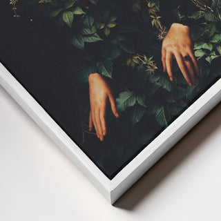 Close-up of Patience II artwork by Frank Moth, showing hands emerging from dense green foliage.