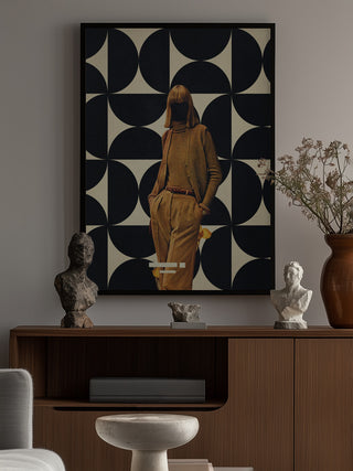 Framed art print from 1978 Annie Collection by Frank Moth above a modern sideboard with sculptures and decor.