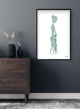 Minimalist art print by Sara Sonne featuring a woman and child, framed on a dark wall above a wooden dresser.