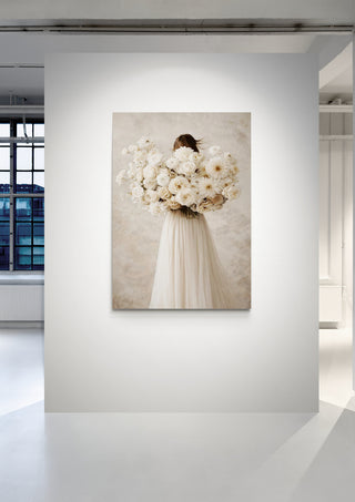 Floralia by Annika Persson artwork showing a woman in a white dress holding large bouquets of white flowers.
