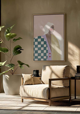 Framed Funky Blouse - Bea Muller artwork hangs above a beige armchair in a sunlit, modern living room.